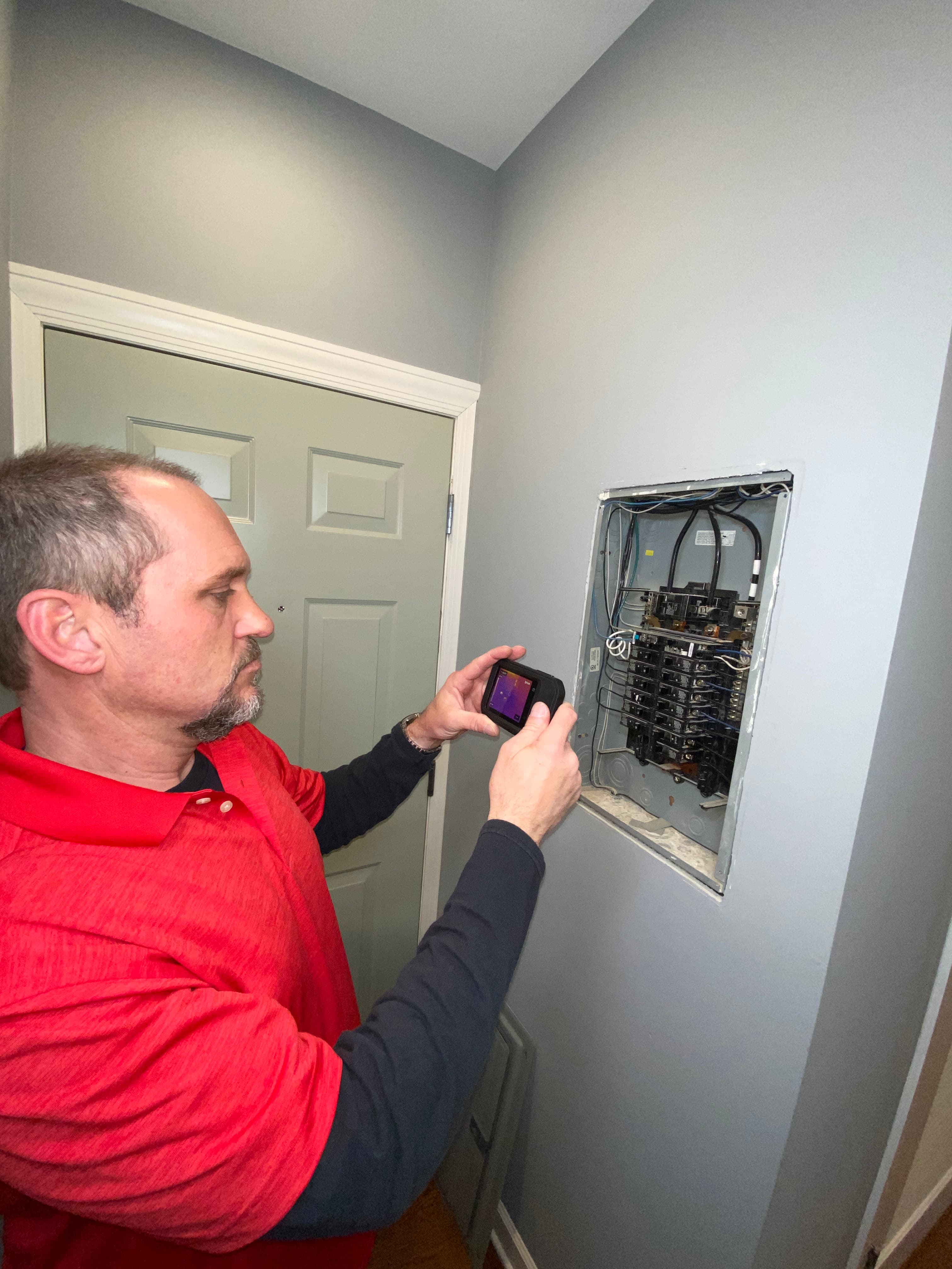Paul Strumberger performing thermal imaging inspection